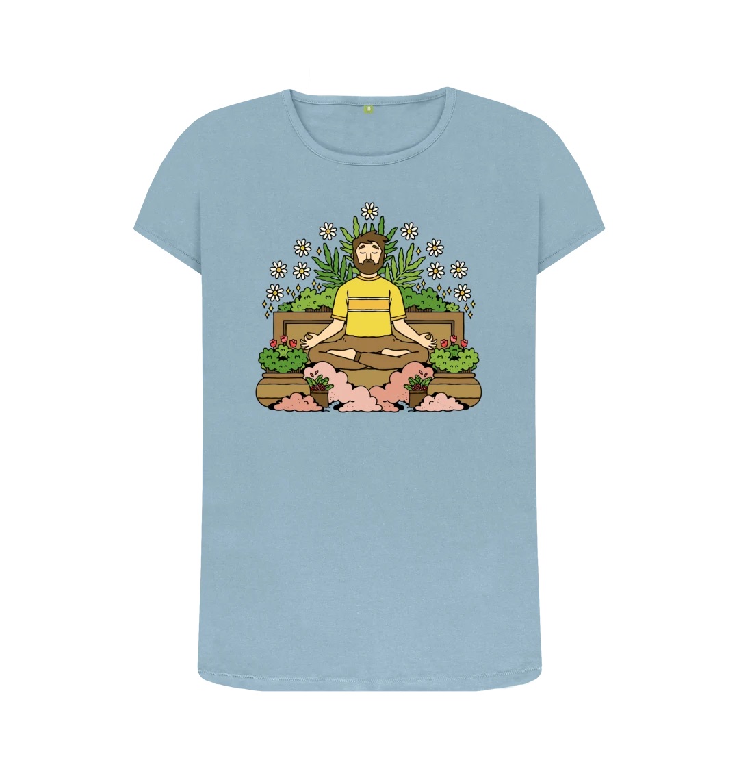 A light blue t-shirt with an illustration across the chest. The illustration features a person in a meditation pose surrounded by plants.